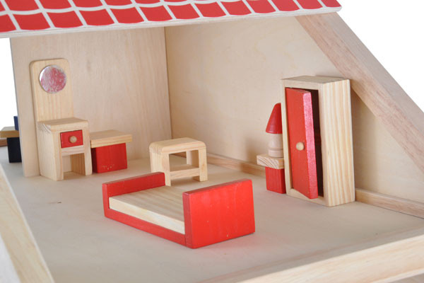 De slaapkamer met bed, wasbak en kast.